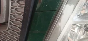 21413734 VOLVO Заглушка решетки левая